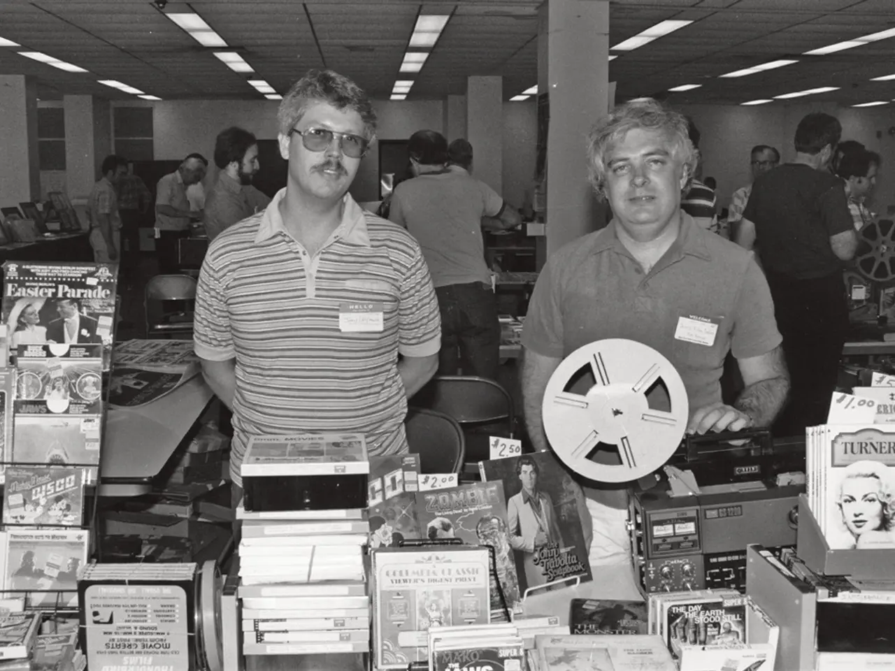 At the bottom of the image there are many books and also there is a tape recorder. On the left side...