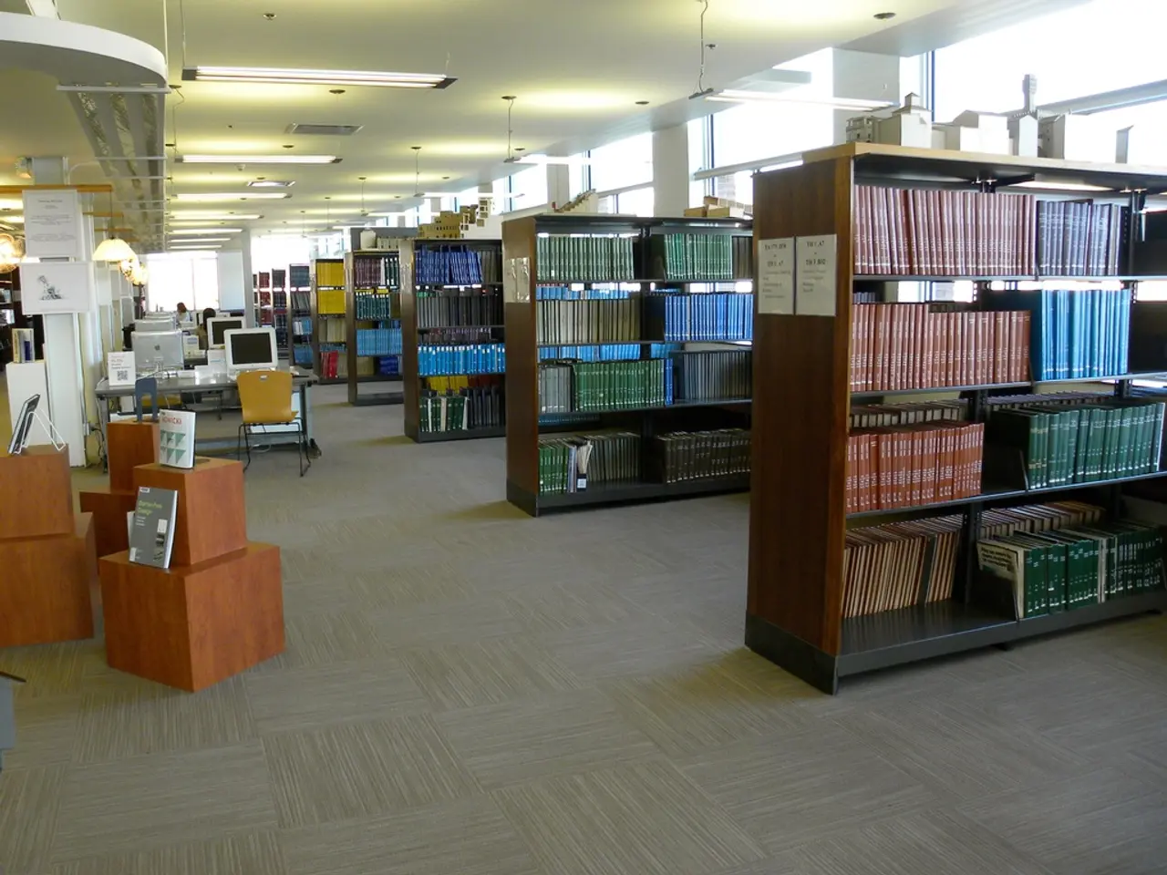 In this image there are books on the racks. There are pipes attached to the racks. On top of the...