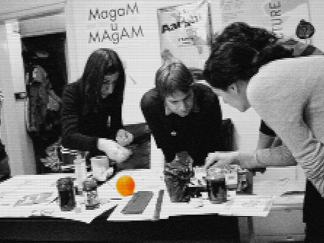 A group of women are doing something on a table.