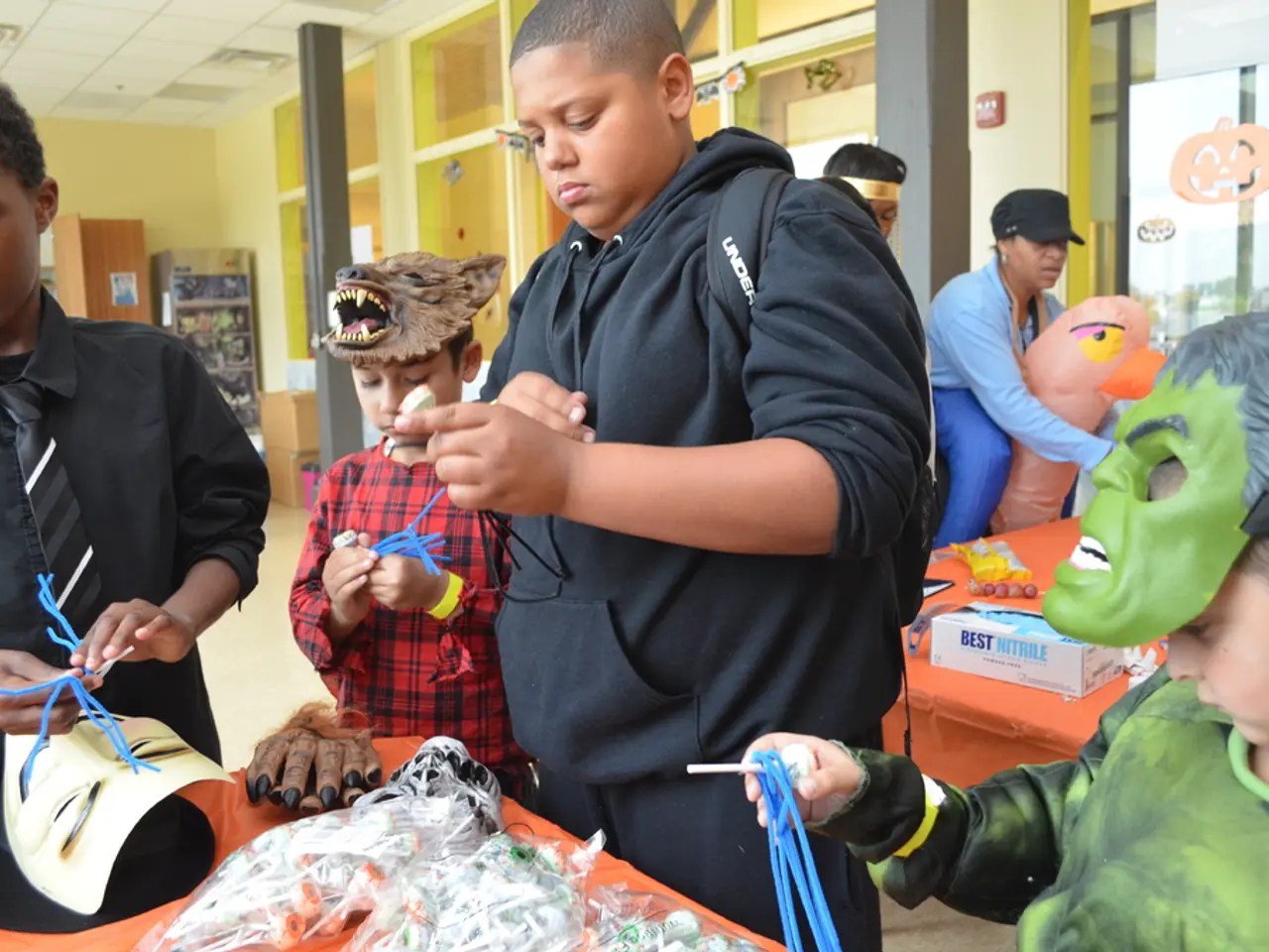 In this image in the foreground there are some child standing and some of them are wearing mask.