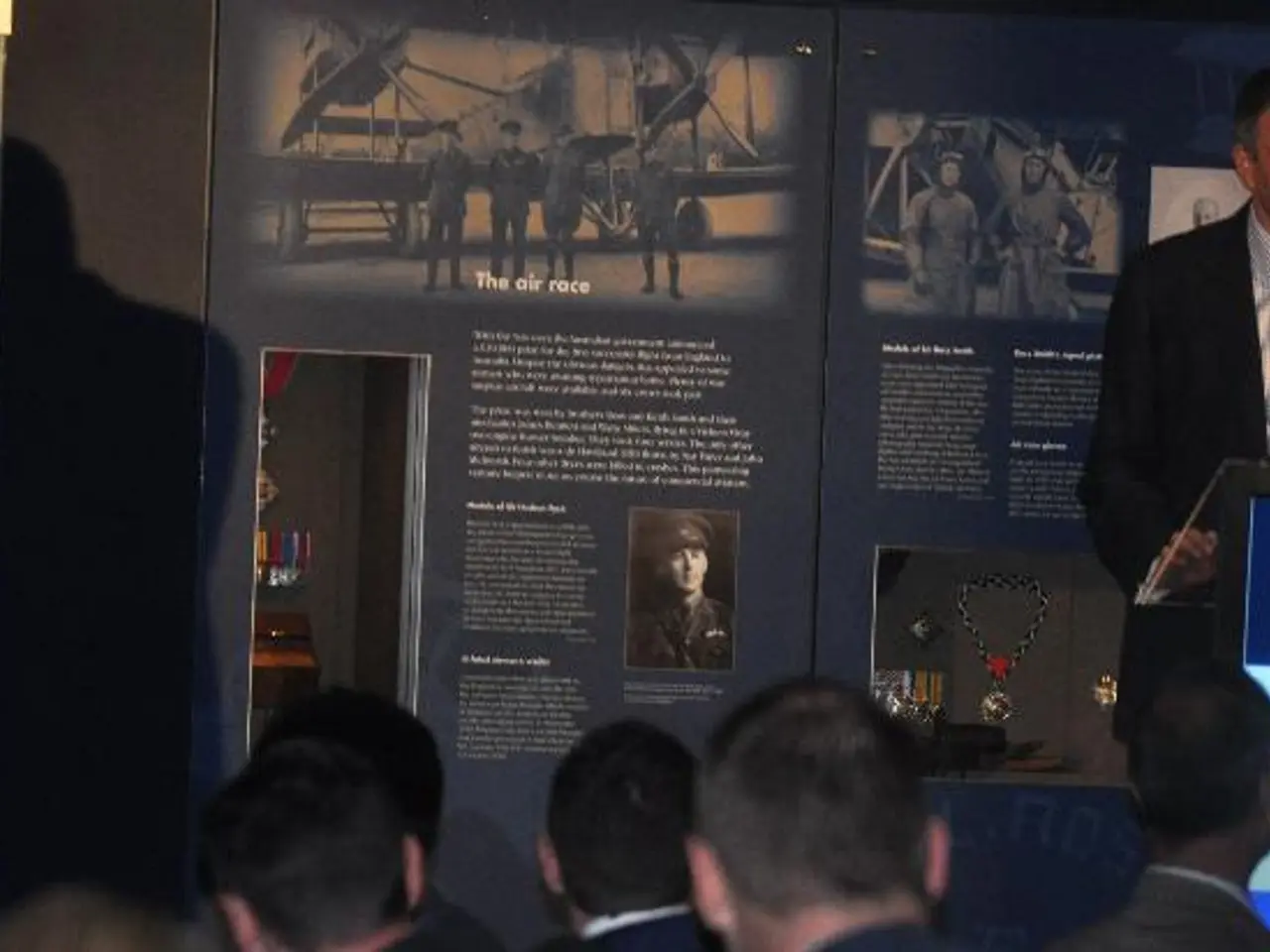 In this image on the right side there is one person who is standing, in front him there is a podium...