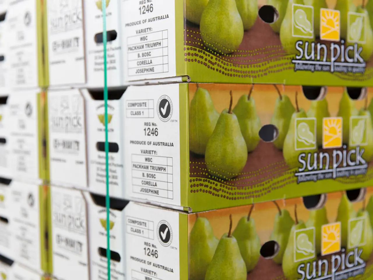 In this picture we can see boxes and on these boxes we can see some fruits and some text on it.