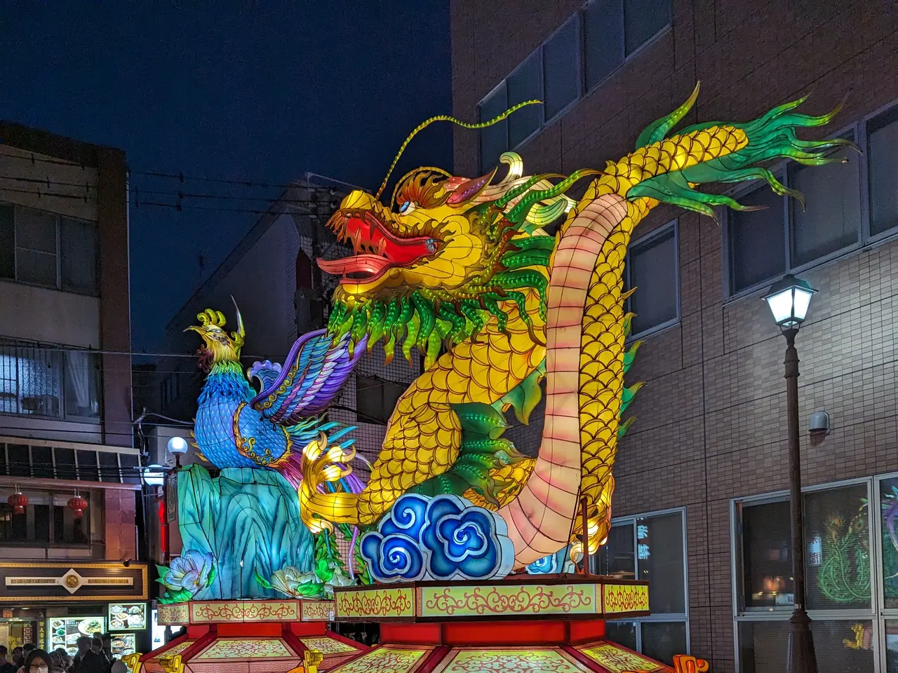 The image shows a vibrant Chinese lantern festival in San Francisco, California. There are people...