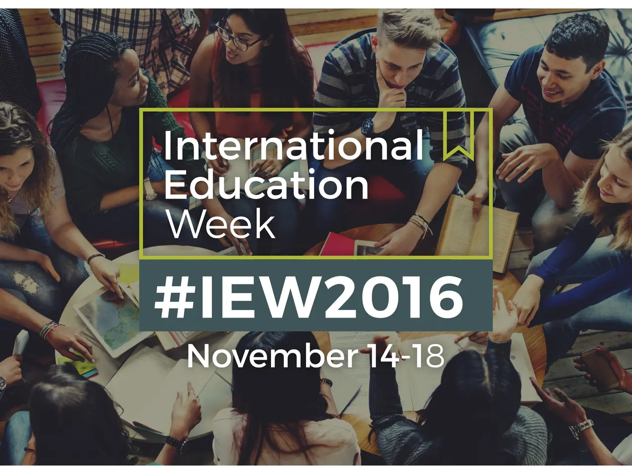 The image shows a group of people sitting on a couch, some of them holding books and pens, with the...