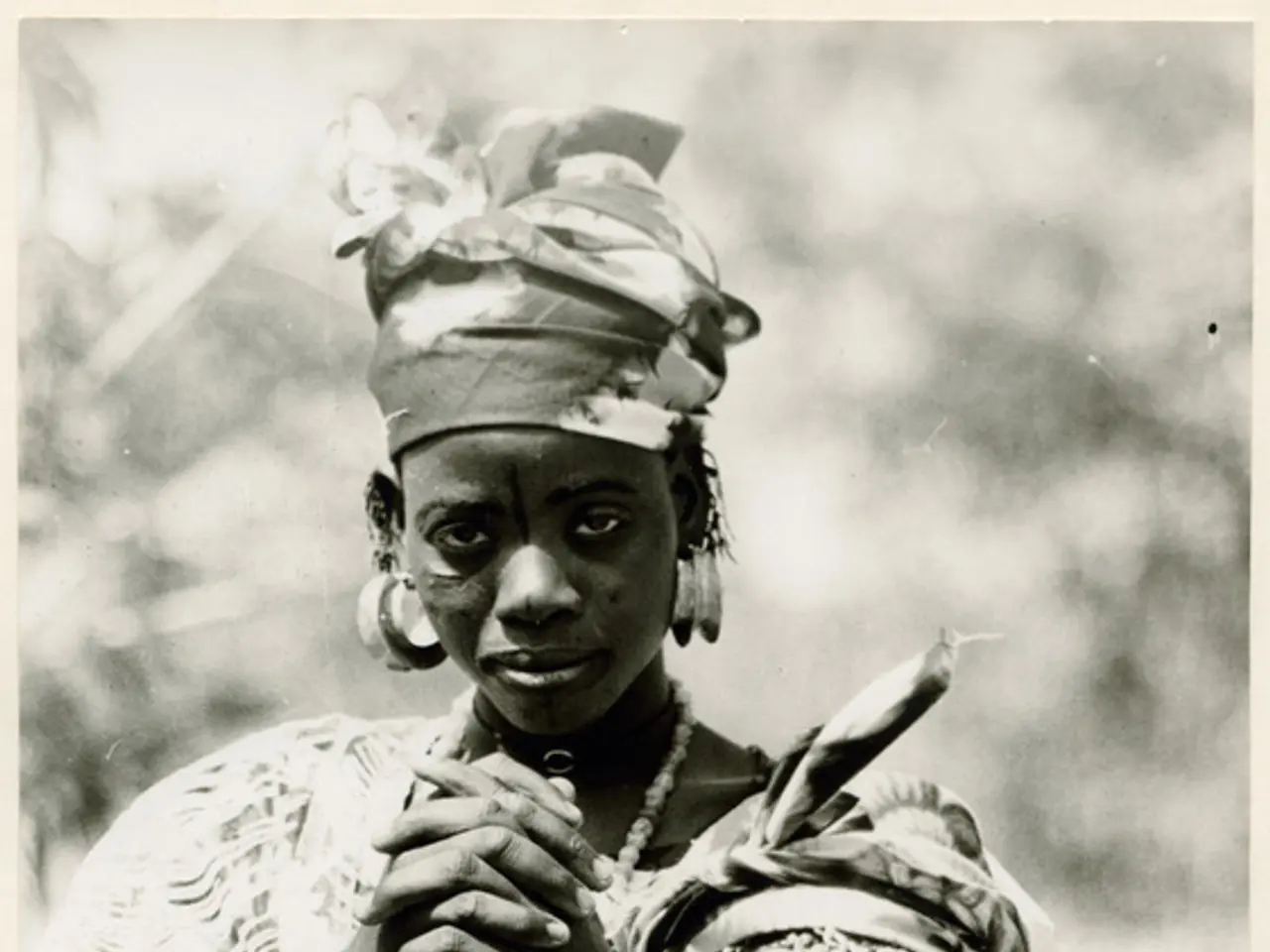 The image shows an old black and white photo of two women from the Omo Valley Tribe in Ethiopia....