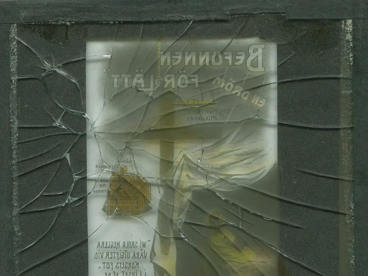 The image shows a broken glass window with a piece of paper attached to it. The paper has text...