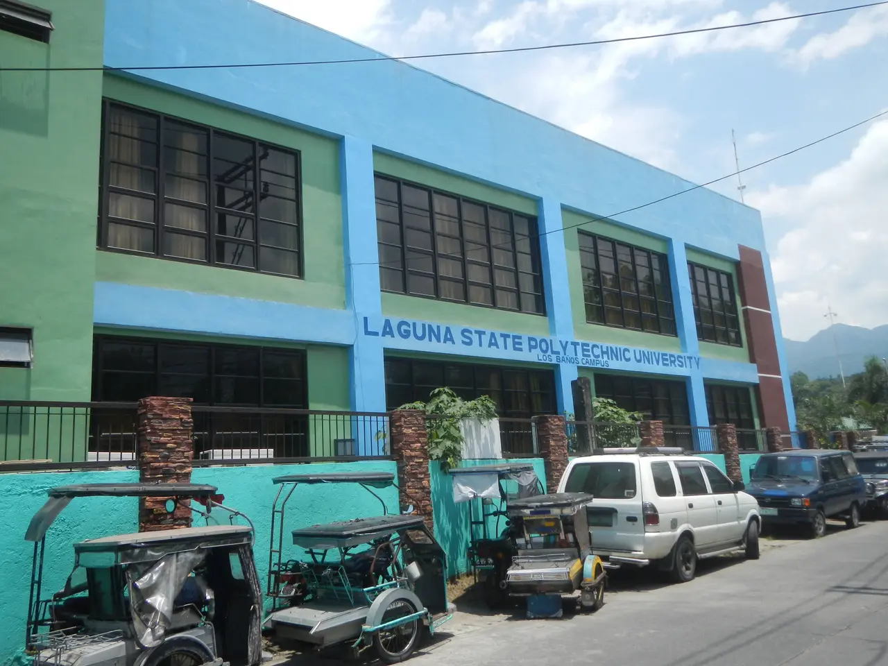 The image shows the Laguna State Polytechnic University in Laguna, Philippines. It is a building...