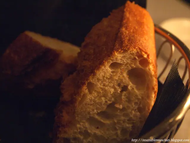 This is a zoomed in picture. In the center there is a bowl containing some food items. At the...