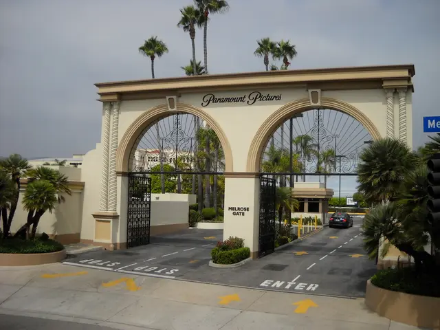 In the foreground of the picture I can see the entrance metal gate construction in the form of arch...