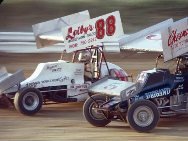 In this image we can see people driving the cars. There is a road safety barrier in the image....