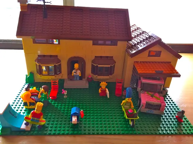 In this picture there is a toy house in the center of the image.