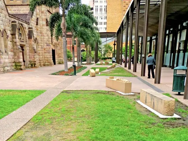 In this picture, it seems like headstones and grassland in the foreground area of the image, there...