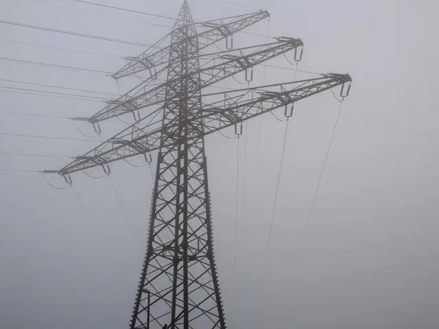 In the image we can see an electric tower and electric wires. This is a sky.