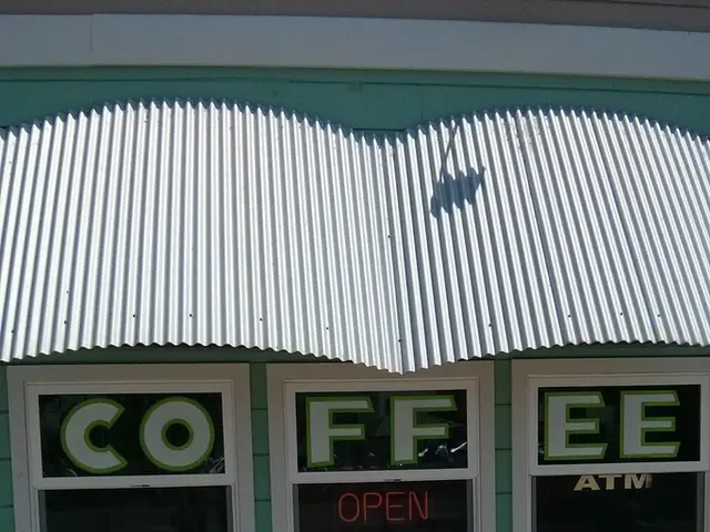 In the center of the image there is a building, wall and a roof sheet. And we can see some text on...