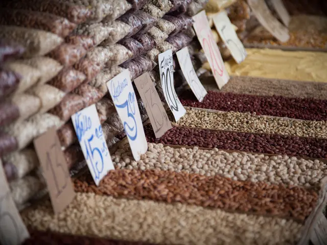 In this image, we can see grains and name boards. Here can see grains are packing with cover.