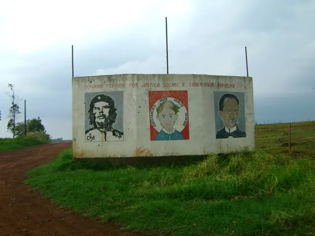 In this picture we can see the paintings of people on the wall and it is written something on the...