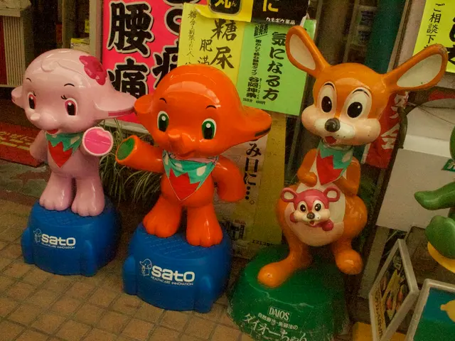 In this image, we can see some statues and there are some posters in the background.