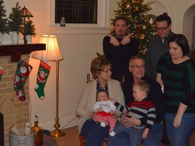 Here we can see few persons. There is a lamp, water tin, banners, flower vases, window, and a...