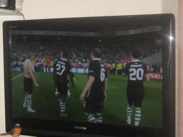 In this picture we can see a television in the television we can find few people.