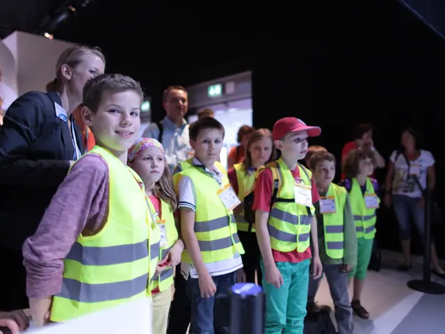 In this image we can see a group of children standing on the floor. They are wearing the safety...