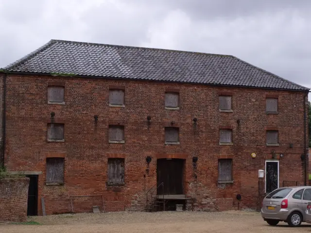 There is a building with windows, doors and steps with railings. On the right side there are...