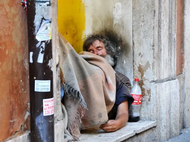 In the center of the picture there is a person sleeping, on him there is a blanket. On the left...