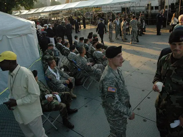 This image is clicked outside. There are tents in this image. There are so many people in this...