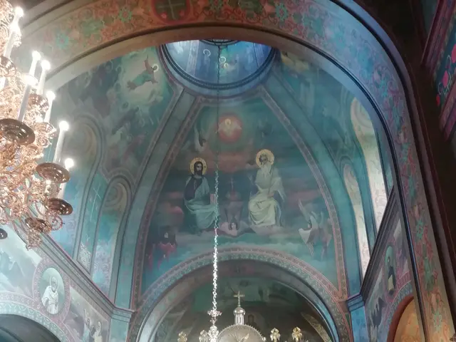 The image shows a group of people standing in front of a church, with chandeliers hanging from the...