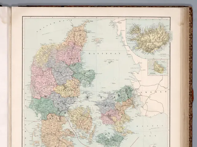 The image shows an open book with a map of Denmark on it. The map is detailed and shows the various...