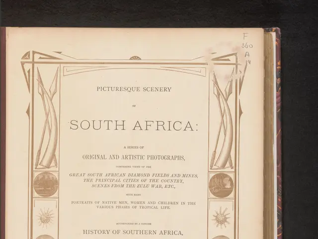 The image shows an open book with a black background and a picture of South Africa on the cover....