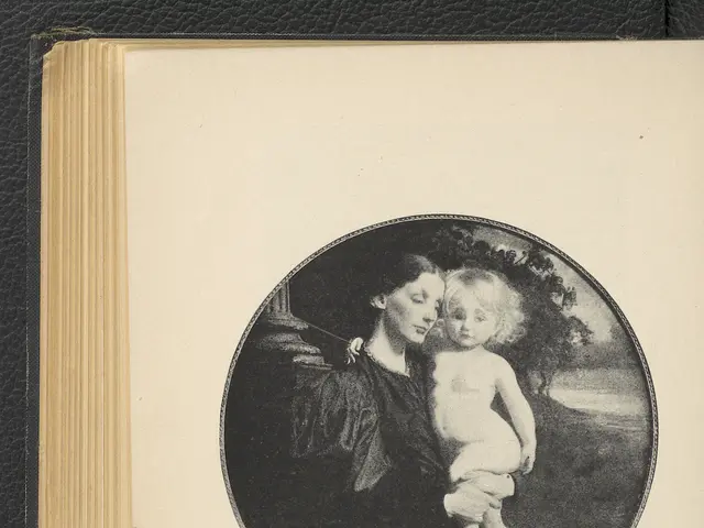 The image shows an open book with a picture of a woman holding a baby in her arms. The woman has a...