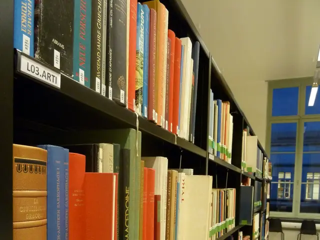 The image shows a long row of books on shelves in a library, with chairs on the floor, lights on...