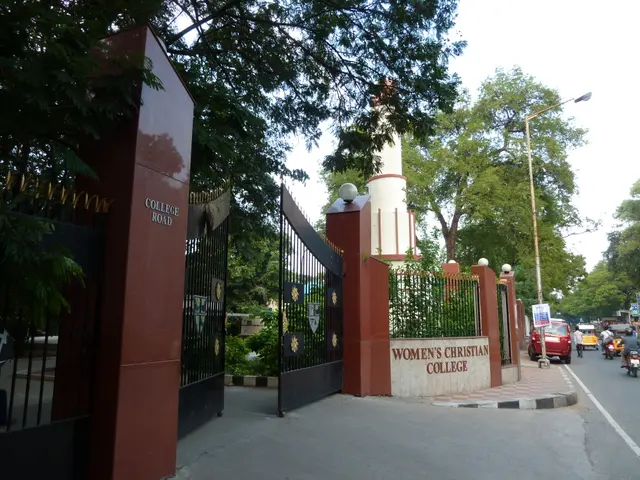 The image shows the entrance to Women's Christian College in Hyderabad, with a gate and wall...