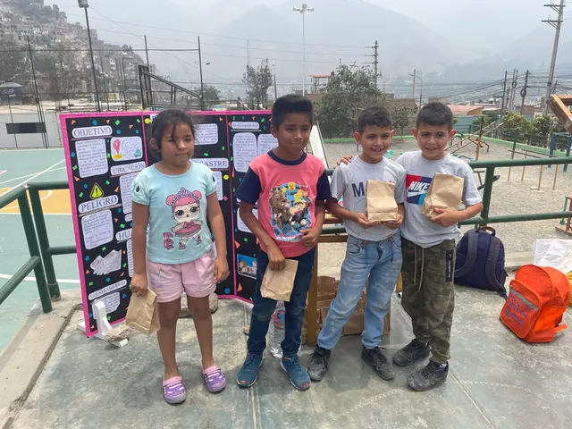 The image shows a group of children standing next to each other on a basketball court, each holding...
