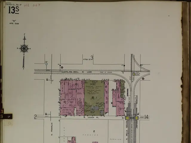 The image shows an open book with a drawing of a city on it. The book is filled with detailed plans...