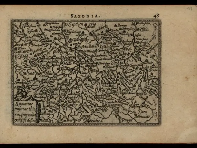 The image shows an old book with a map of Saxonia on it, set against a black background. The map is...