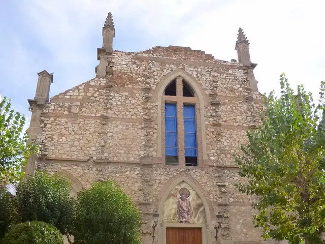 The image shows a group of people walking down a street in front of a church. The church has...