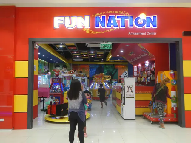 The image shows a fun nation amusement center in Singapore, with a group of people standing on the...