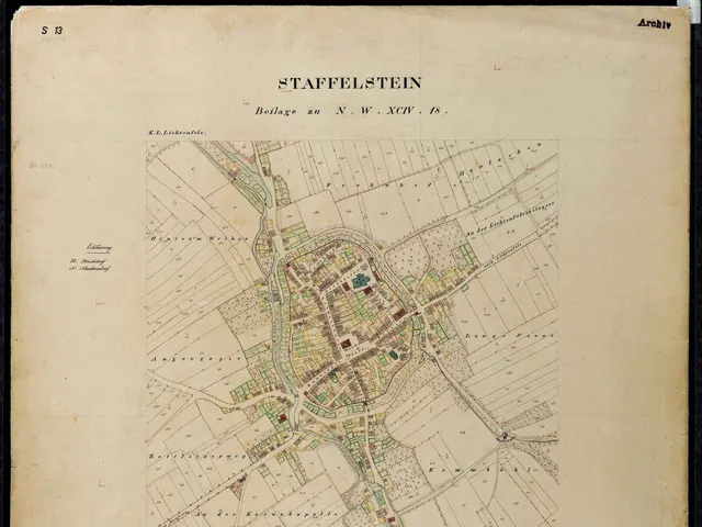 The image shows an old map of the city of Staffelstein, Germany, with a black background. The map...