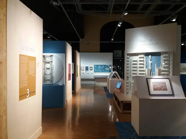 The image shows a room filled with lots of different types of art on display, including photo...