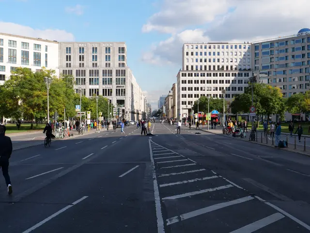 The image shows a bustling city street in Berlin, Germany, with people walking and riding bicycles...