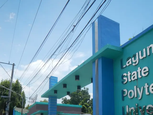 The image shows the entrance to Laguna State Polytechnic University, with a name board on the right...