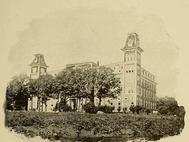 The image shows a black and white photo of the main university building, surrounded by trees and...