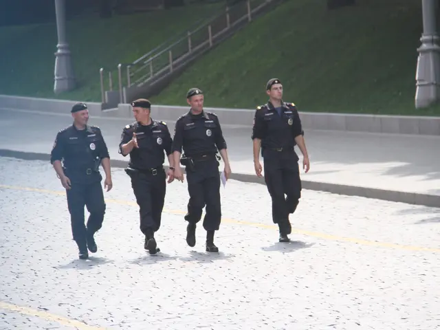 The image shows three police officers walking down the street, wearing their uniforms and caps. In...