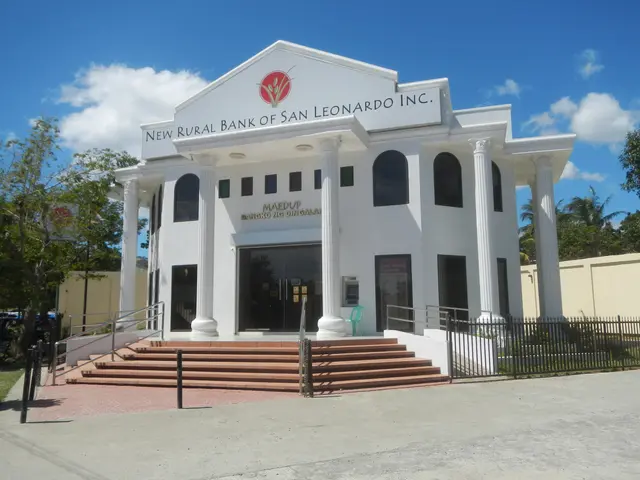 The image shows the new rural bank of San Leonardo, Inc. It is a building with windows, pillars,...