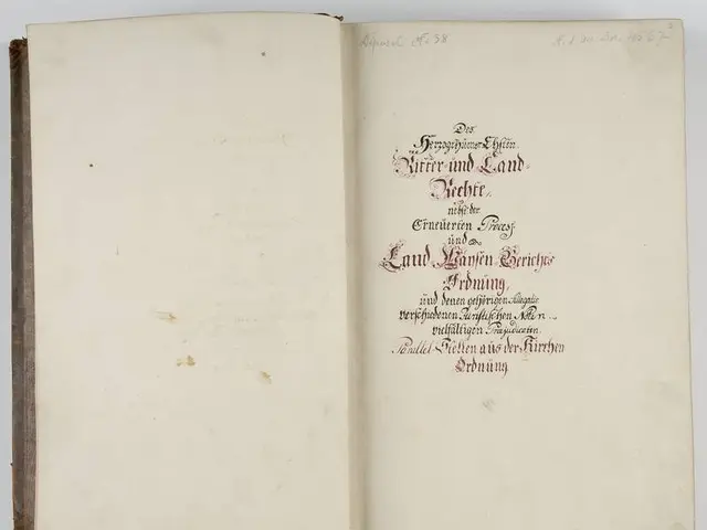 The image shows an open book with red writing on it against a white background. The text on the...