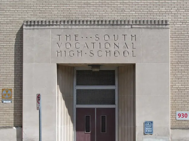 The image shows the South Vocational High School, a building with a door and sign boards on the...