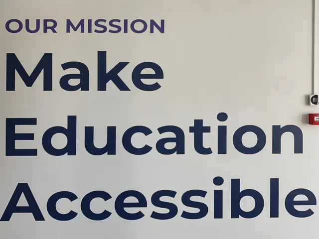 The image shows a whiteboard with the words "Our Mission Make Education Accessible" written on it,...
