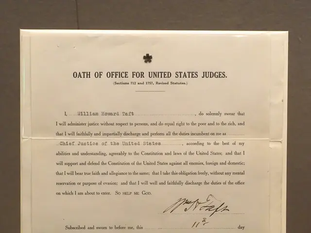 The image shows a paper with text on it placed on a table in front of a wall. The text reads "Oath...