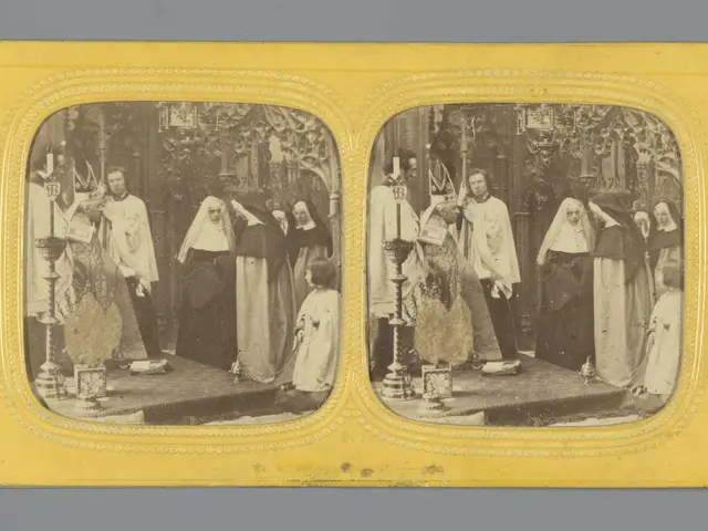 The image shows an old black and white photo of a group of people standing on a stage, with a grey...